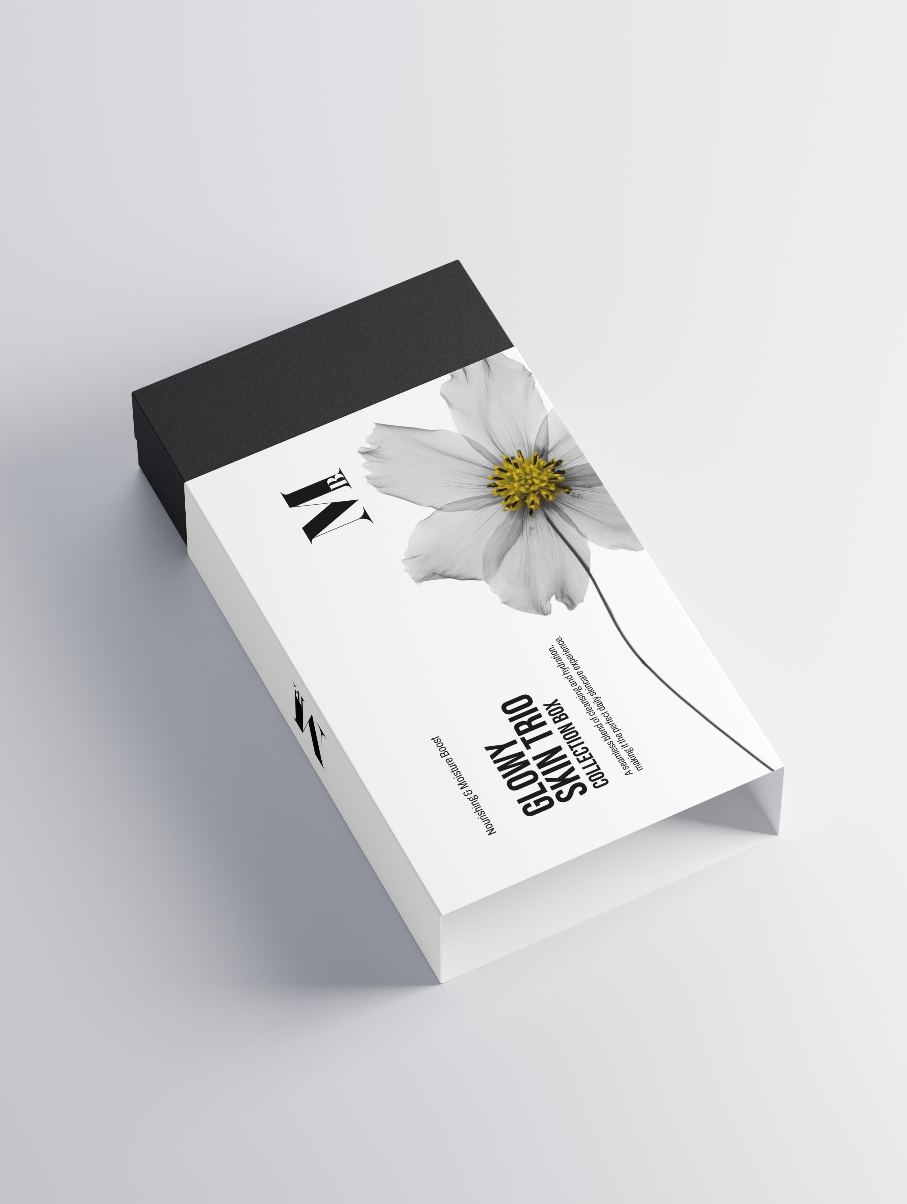 Product packaging with a white flower design on a gray background