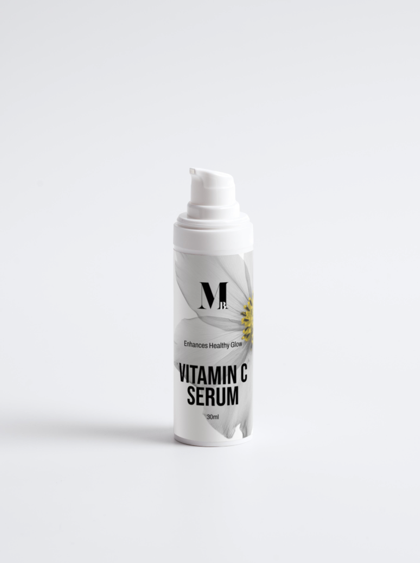 White vitamin serum bottle with black text on a light gray background