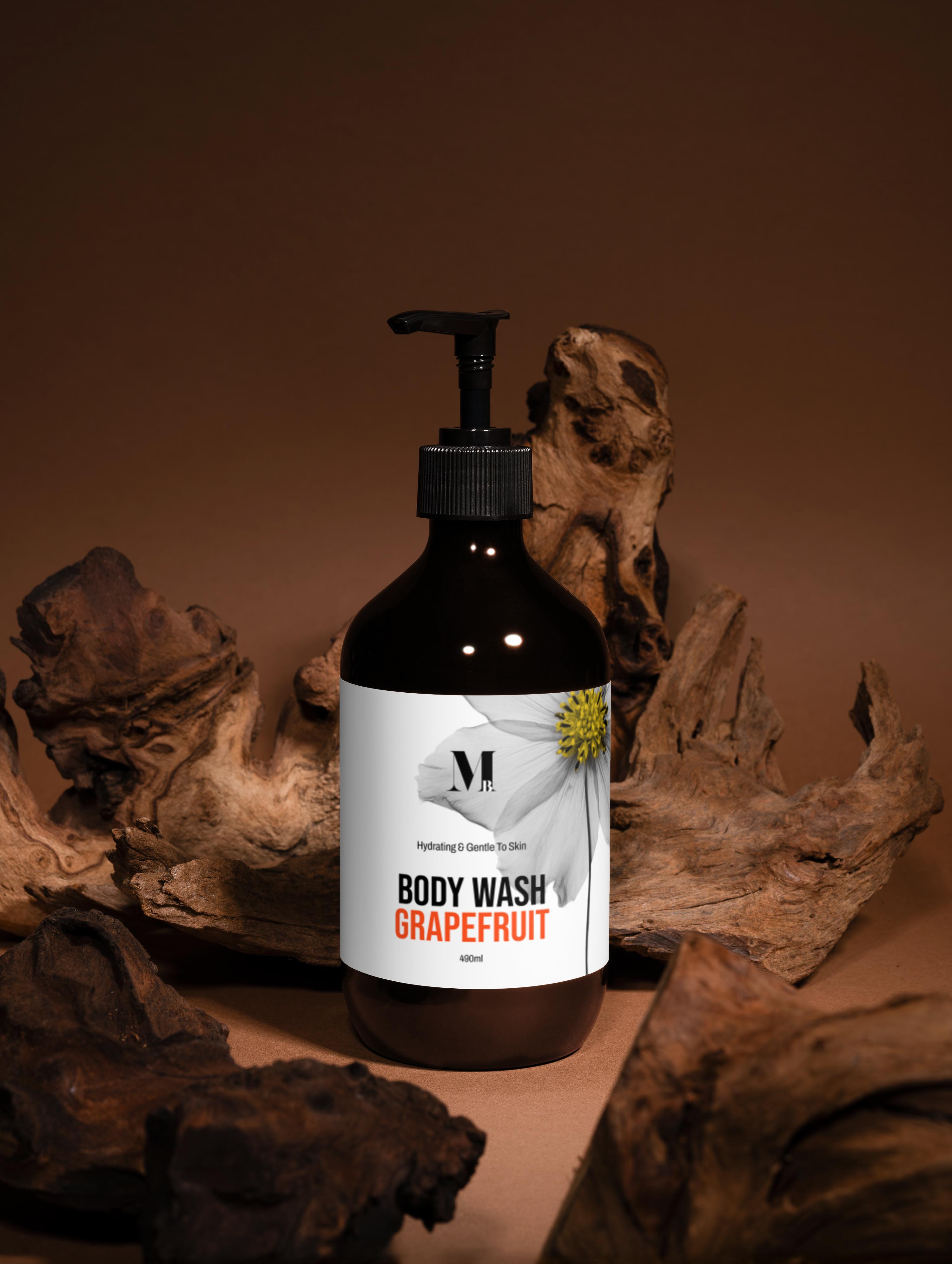 Body wash bottle labeled 'Grapefruit' with a brand logo on a brown background